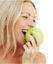 smiling girl holding apple